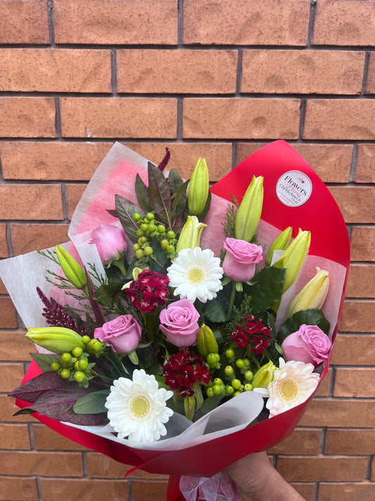 Bouquet of flowers with red wrap