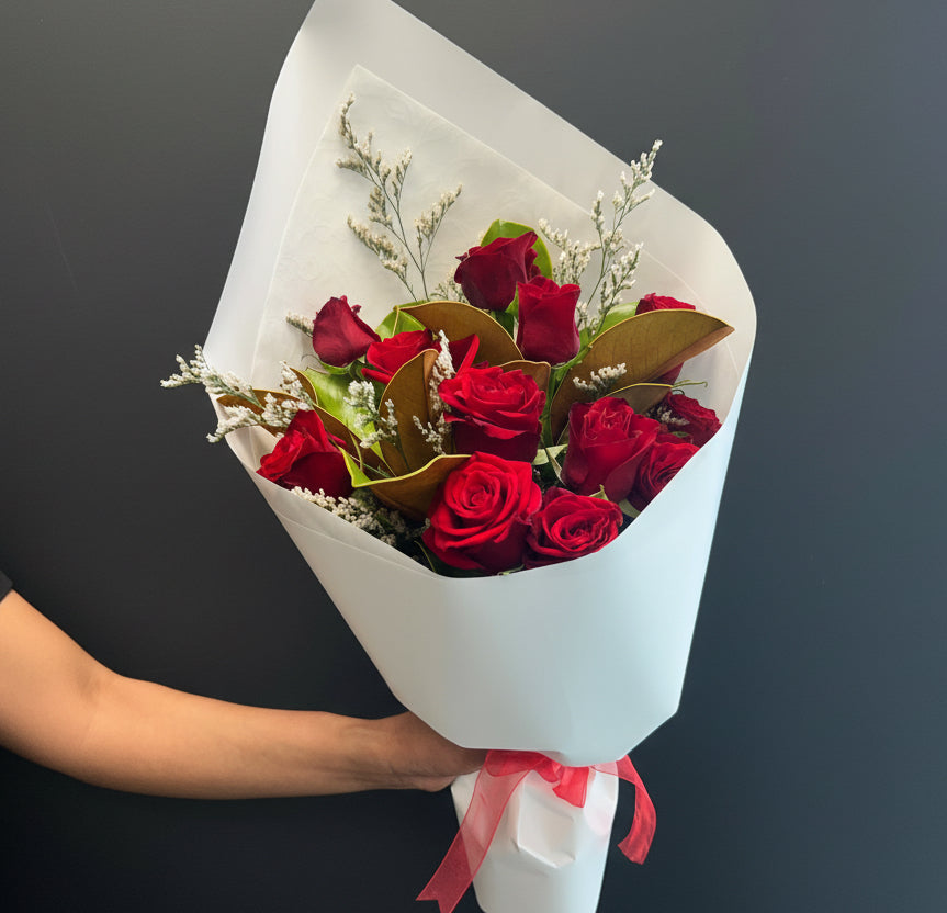Bouquet of red roses with a white wrap