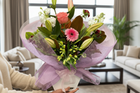 Bouquet of flowers wrapped in pink paper