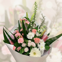 Bouquet of flowers with pink, white, and green colors on a blurred background